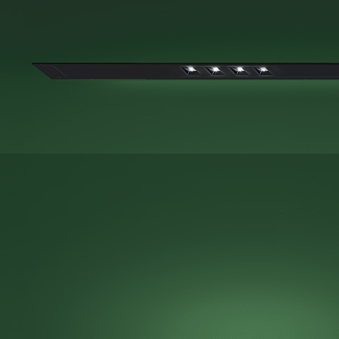 Artemide A.39 Incasso Emissione Sharping: black recessed ceiling fixture with four adjustable LED spotlights flush-mounted on green ceiling