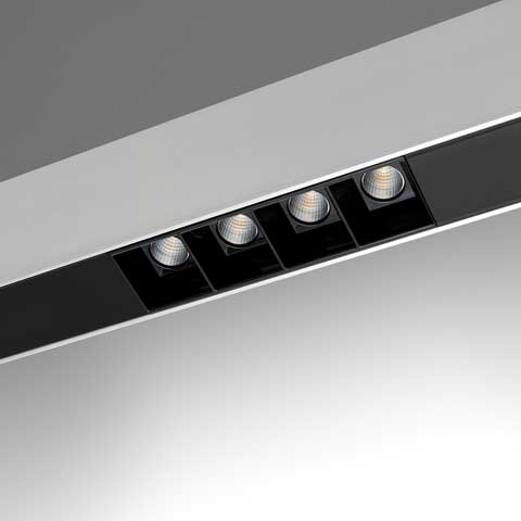 Sharping recessed ceiling light fixture with four adjustable LED spotlights in black housing integrated into a slim white linear profile