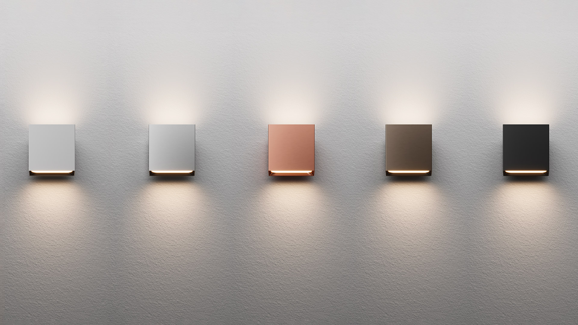 Four Artemide Agathe wall lights mounted in pairs: two white cube fixtures on left wall, two wood-finish cubes on right wall, casting warm upward and downward light