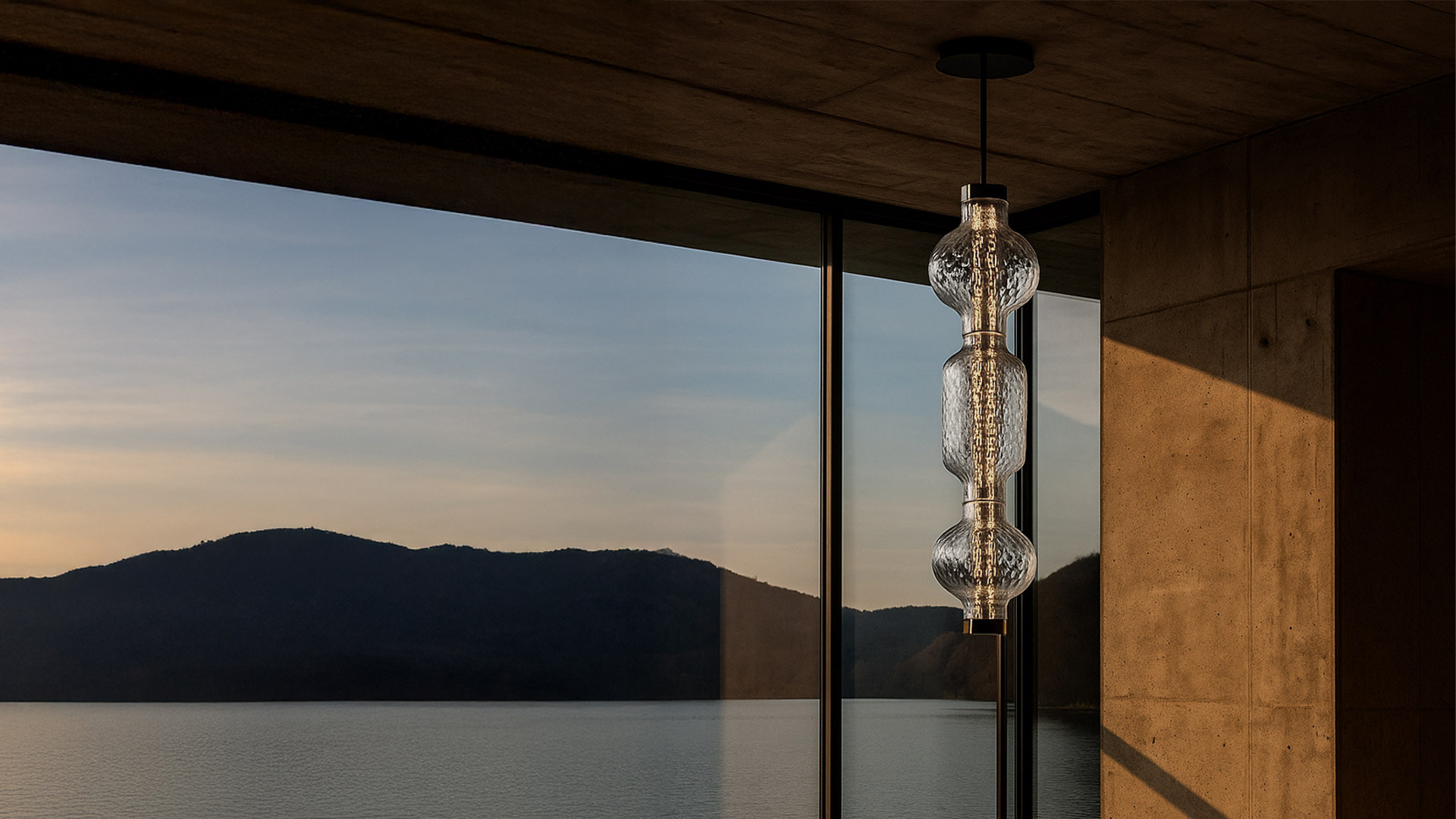 Artemide Alambicco pendant lamp: textured clear glass sphere and cylinder with inner LED light column, chrome metal fitting