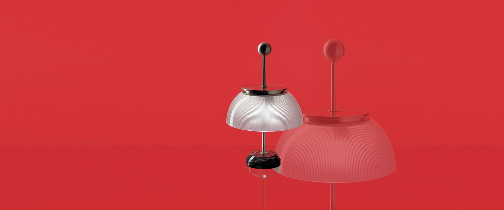 Artemide Alfa table lamp with white opal shade, slender metal stem, spherical finial, and black marble base on white surface