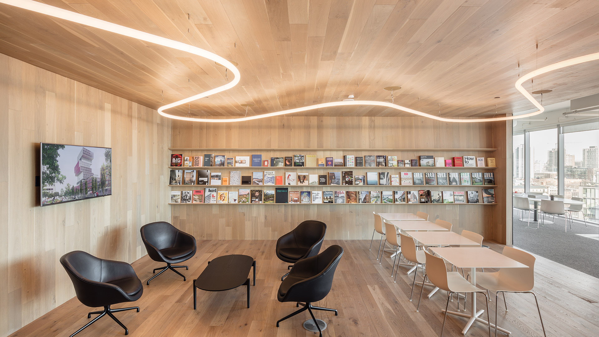Artemide Alphabet of Light System: continuous LED linear module forming a fluid, curved suspended installation against a grey wall