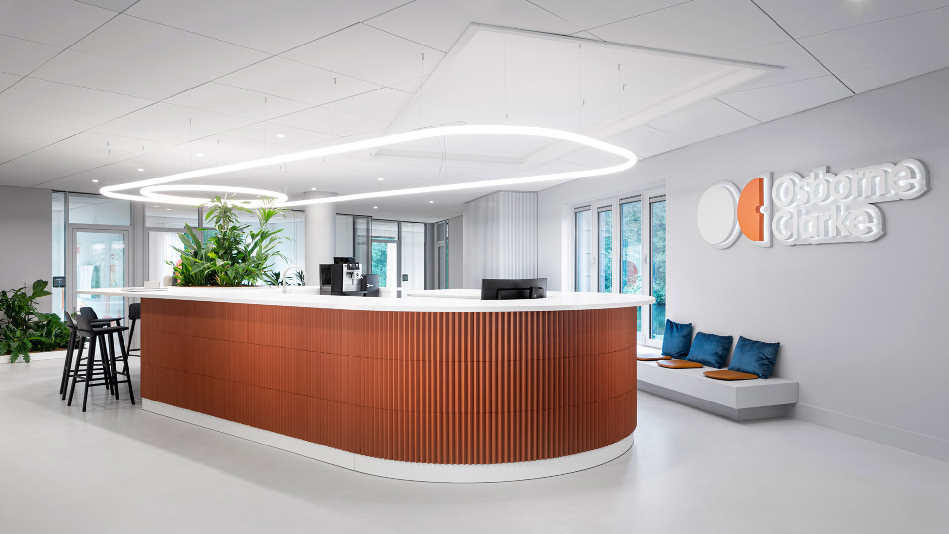 Artemide Alphabet of Light Circular: large oval LED ceiling lamp emitting warm white light, mounted flush on white ceiling