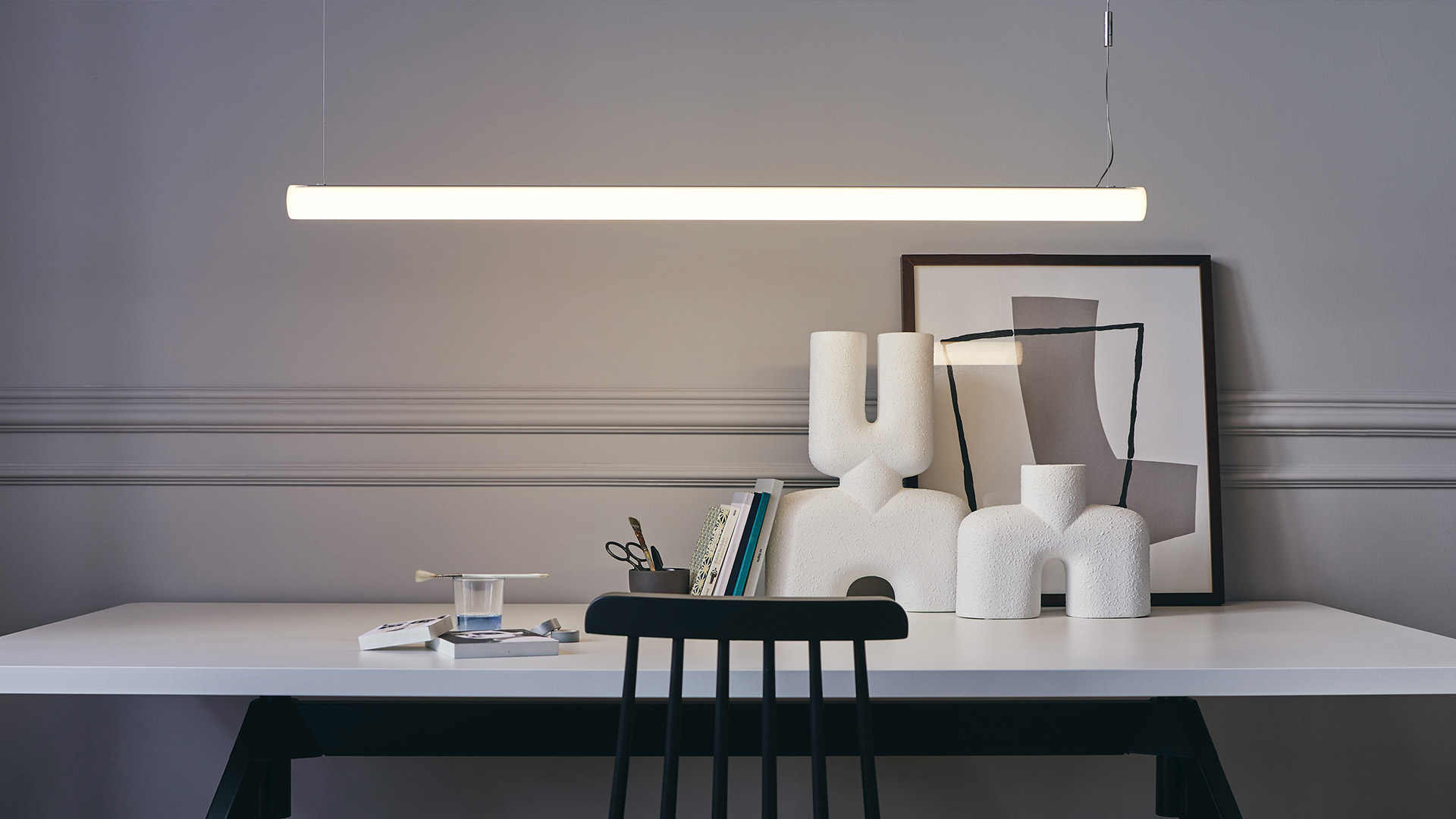 Artemide Alphabet of Light Linear pendant lamp: elongated white opal tube emitting uniform diffused light, suspended by thin cables