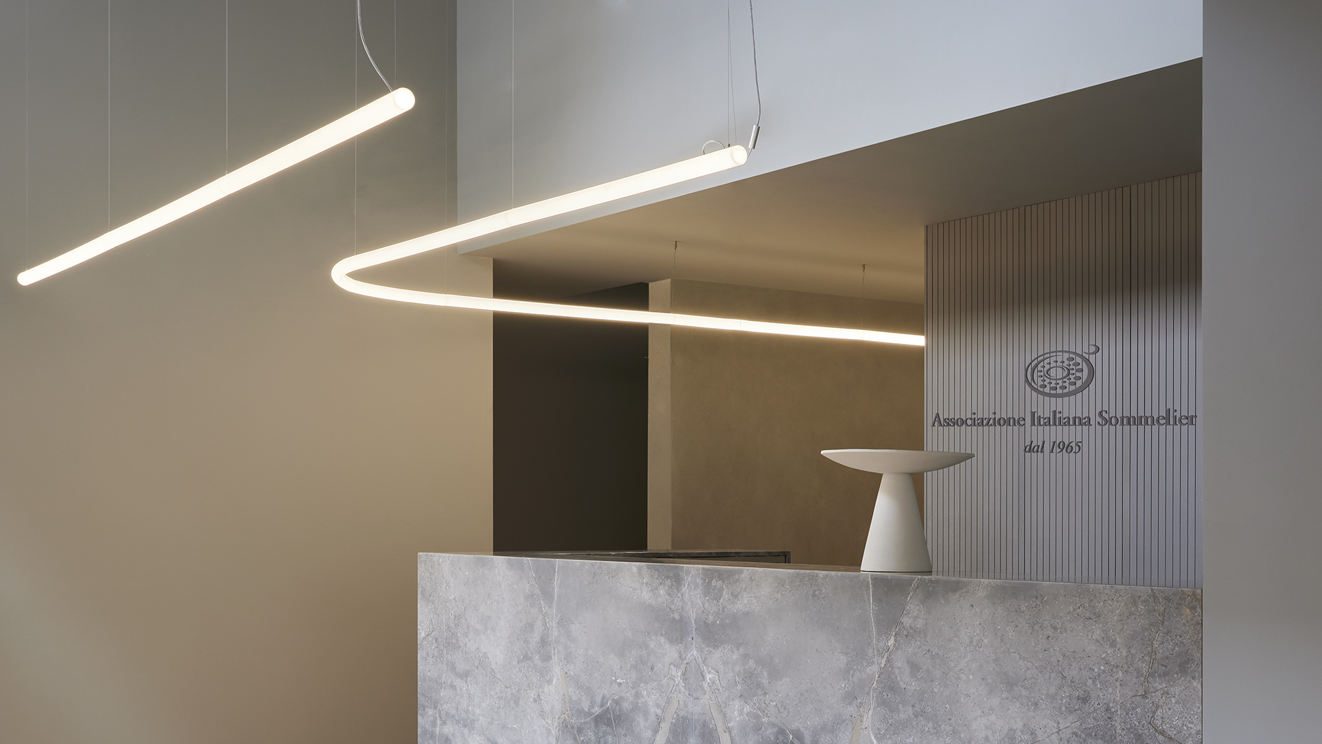 Artemide Alphabet of Light Linear ceiling lamp: sleek white elongated fixture with two segments, flush-mounted, emitting uniform bright light
