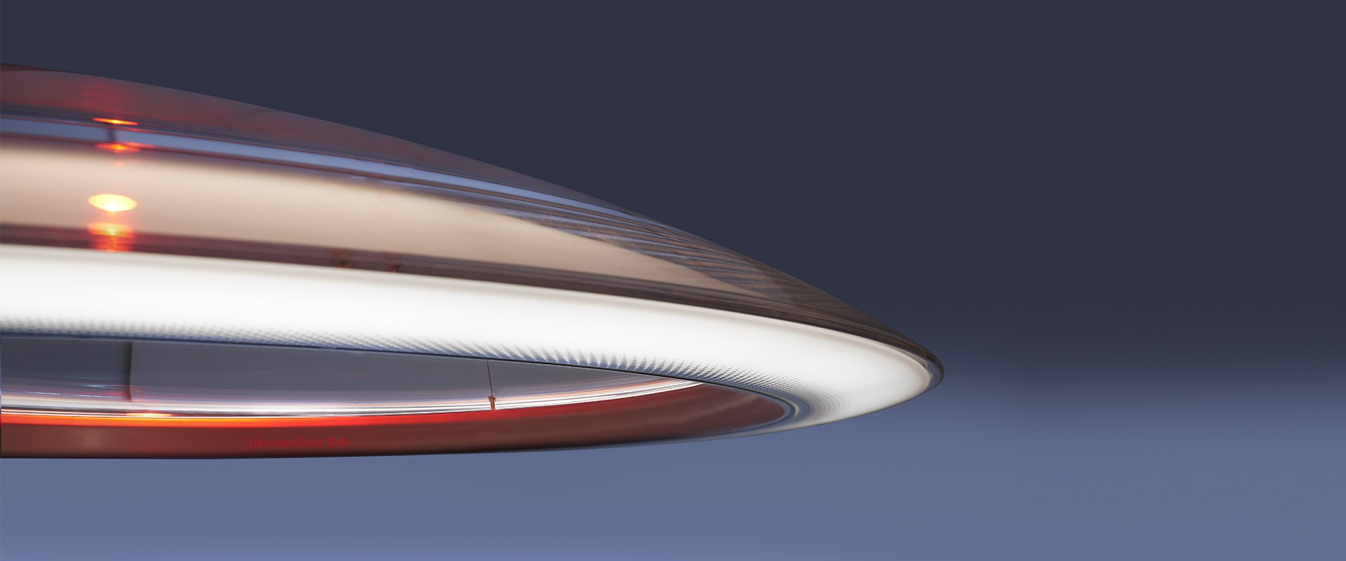 Artemide Ameluna pendant lamp: sleek circular disc design with warm LED ring light and copper-toned accents, viewed from below