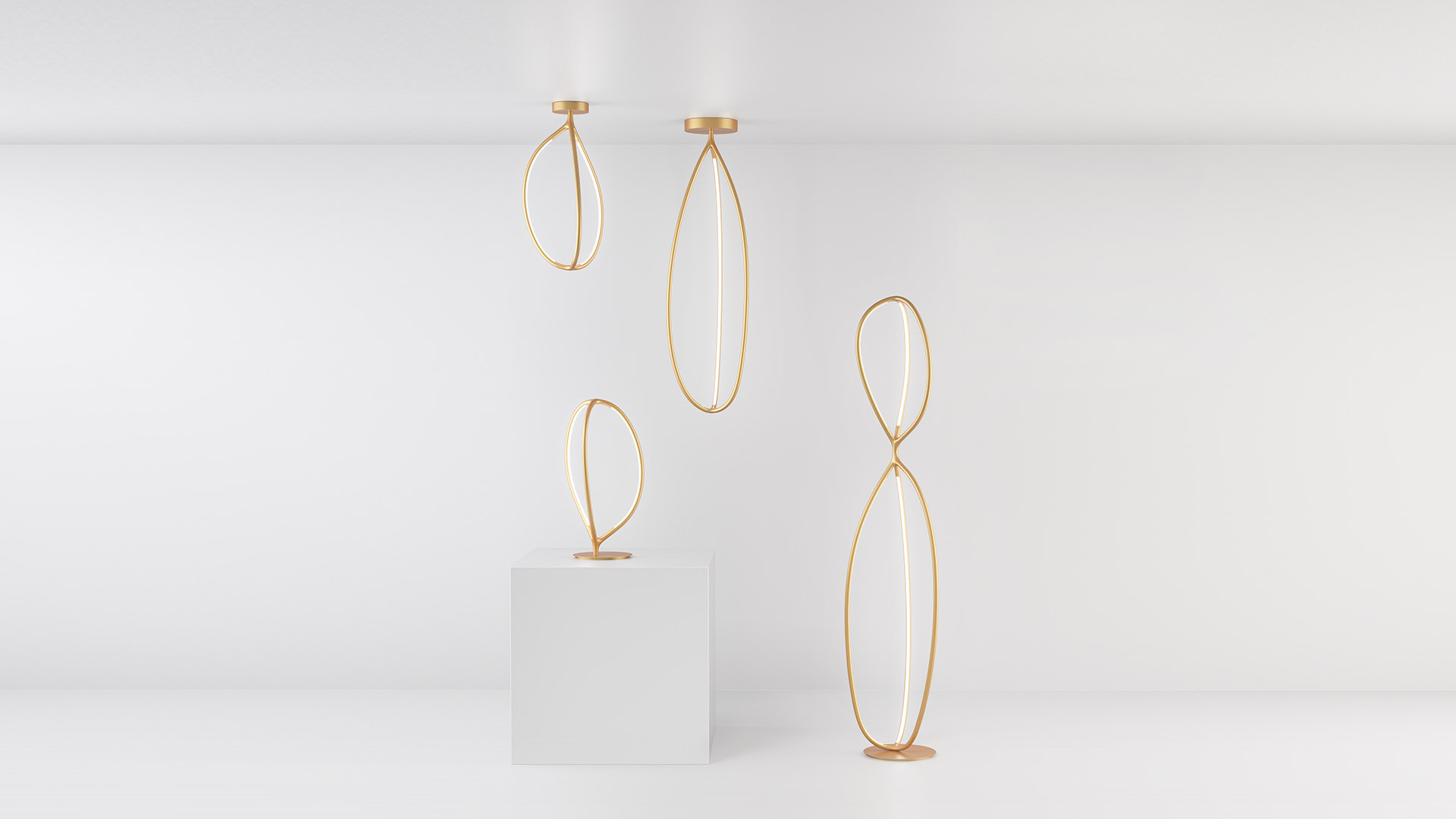 Artemide Arrival collection: gold oval LED ring lamps in pendant, table, and floor versions against a white background