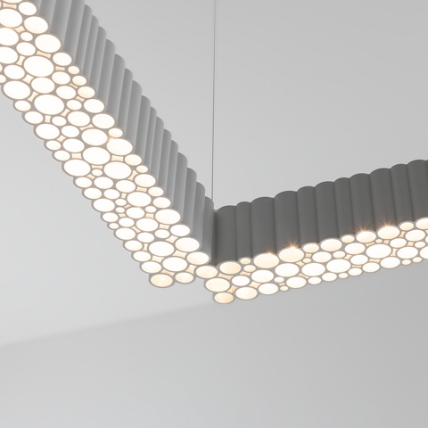 Artemide Calipso Linear System pendant: L-shaped grey aluminum profile with circular LED diffusers creating a bubble-like pattern