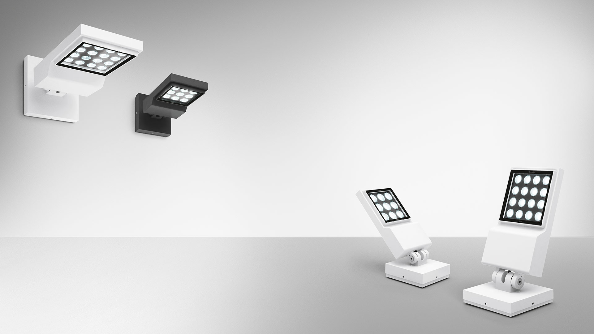 Artemide Cefiso LED wall and floor lights in white and black, featuring adjustable square heads with multiple LED arrays