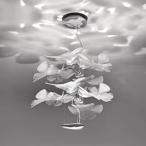 Artemide Chlorophilia 2 pendant lamp with layered translucent leaf-shaped diffusers casting organic light patterns on ceiling