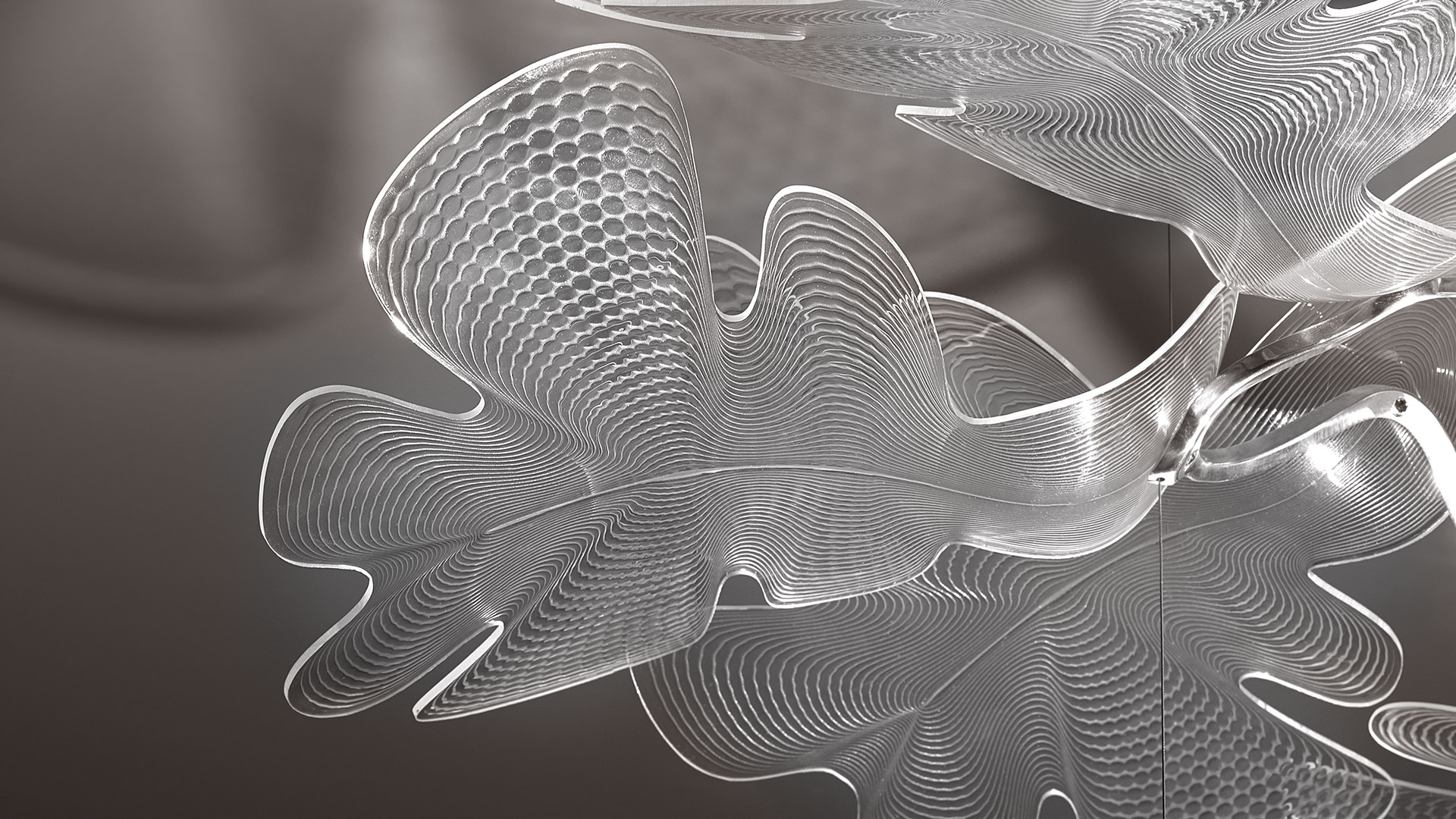Artemide Chlorophilia pendant lamp: organic white sculptural diffuser with leaf-like petals suspended from thin cables