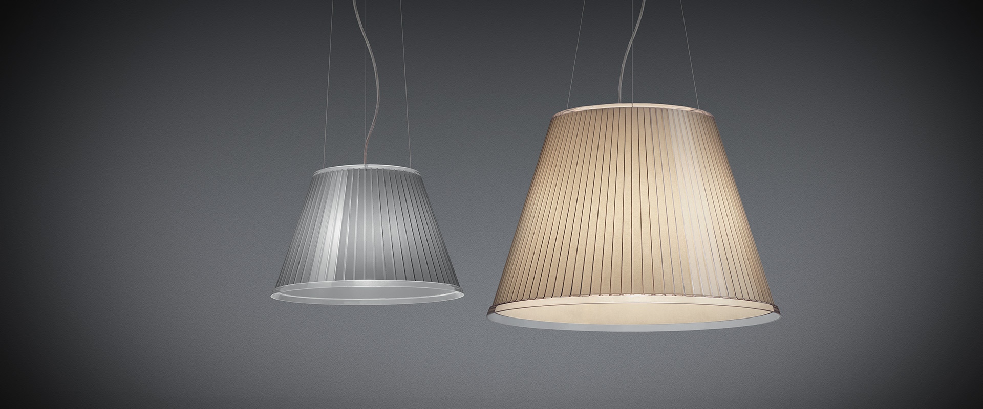 Two Artemide Choose Mega pendant lamps: left silver pleated fabric shade, right warm beige pleated fabric shade, both conical