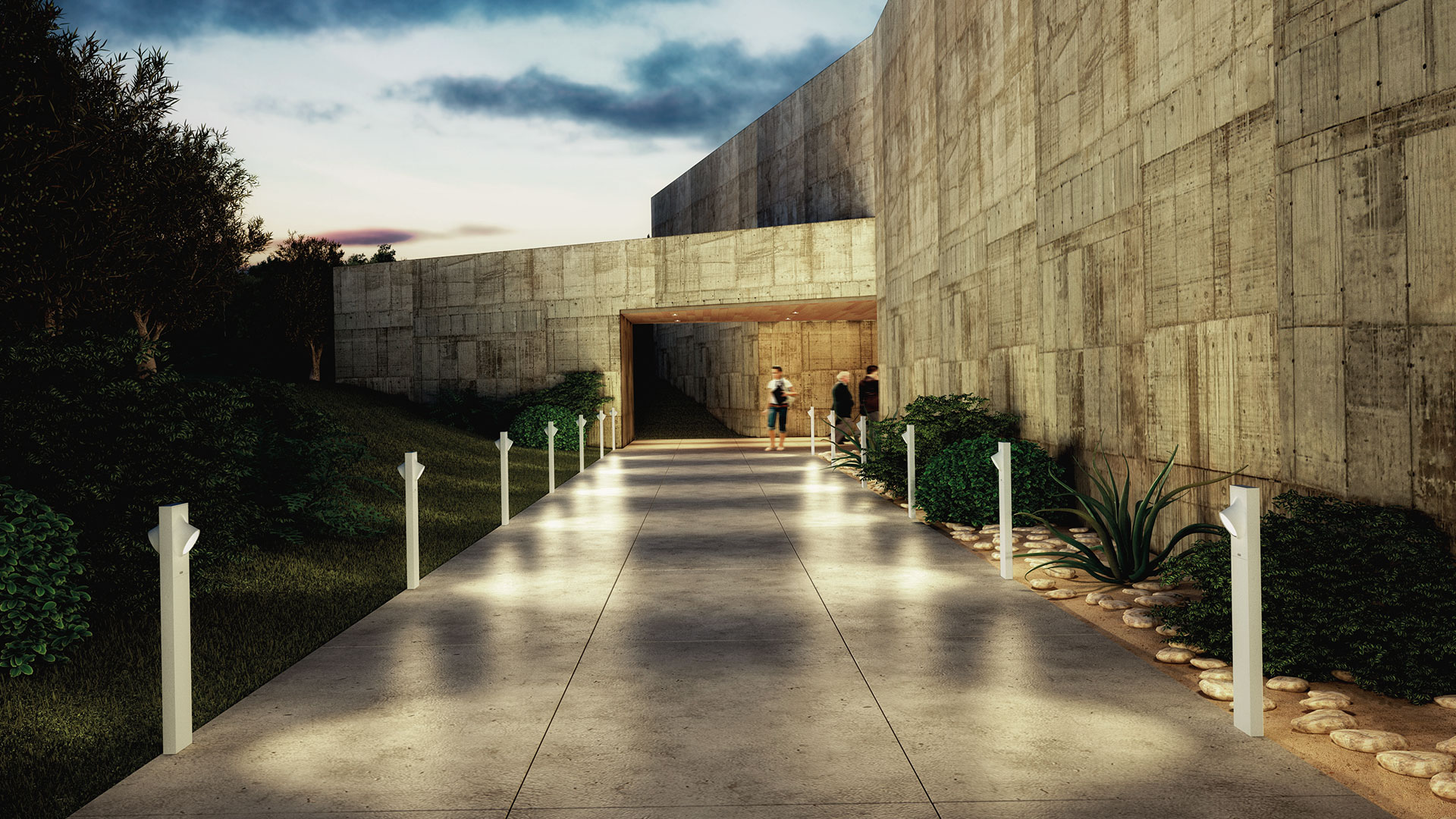Outdoor pathway at dusk flanked by Artemide Ciclope bollard lights, leading to a concrete brutalist building entrance.