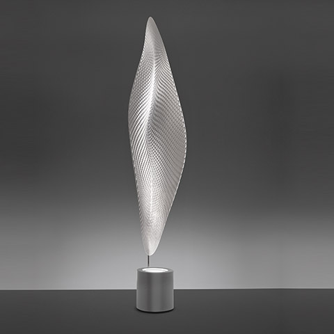 Artemide Cosmic Leaf floor lamp: tall leaf-shaped silver diffuser with textured mesh pattern on a cylindrical aluminum base