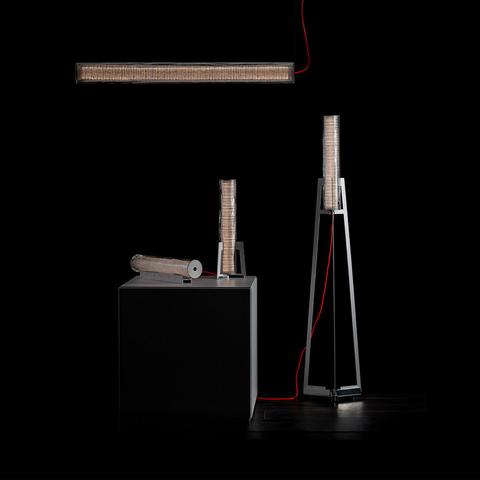 Artemide Criosfera collection: horizontal pendant, table and floor lamps with textured cylindrical shades and red cables on dark background