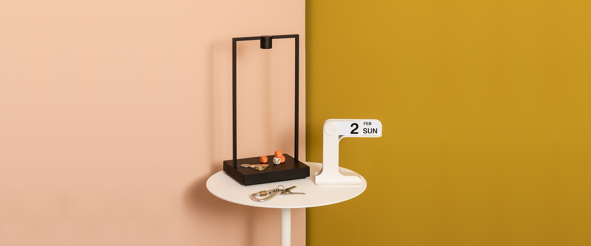 Artemide Curiosity table lamp: minimalist black rectangular frame with single LED light source mounted on a flat square base