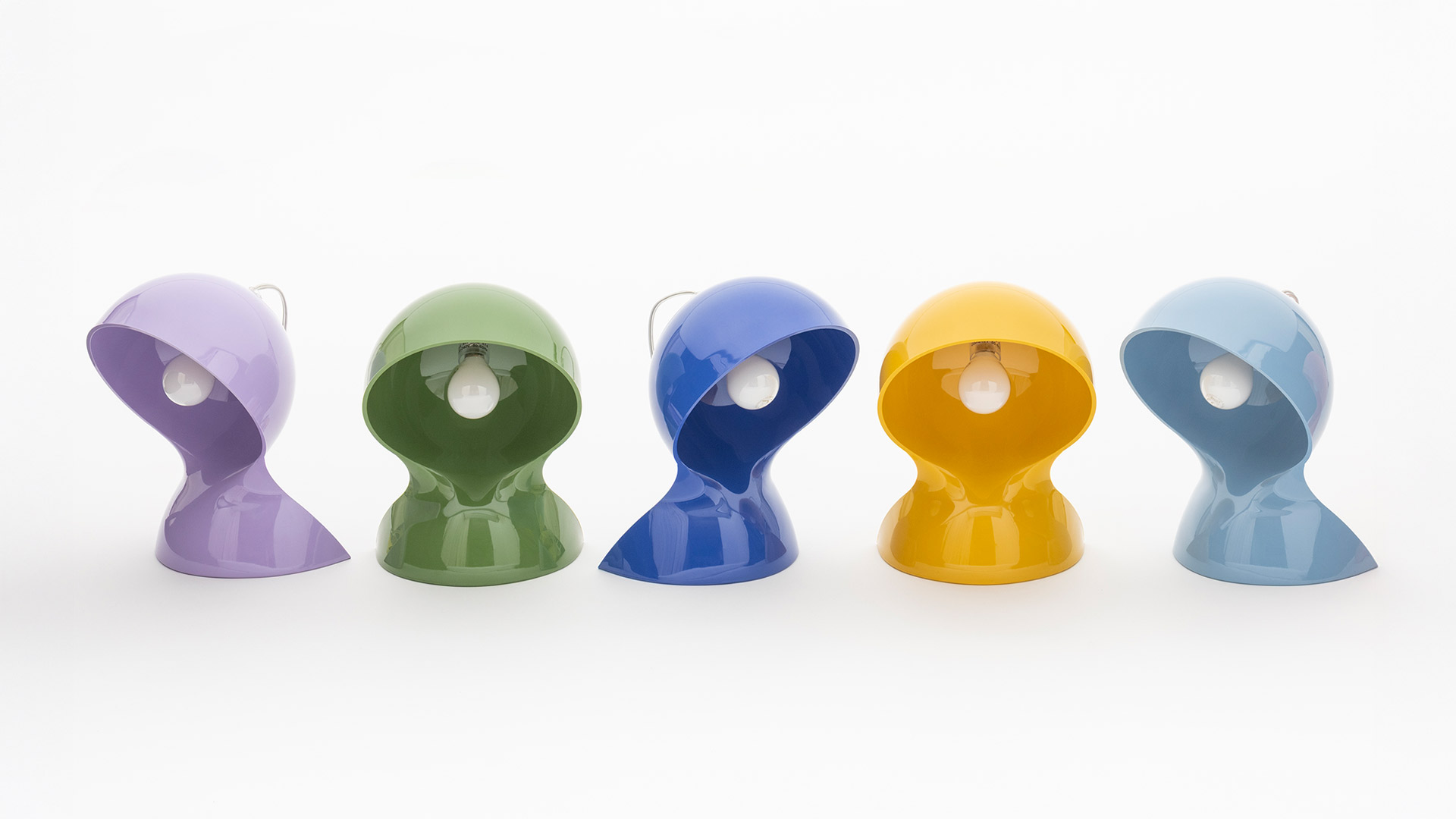 Seven Artemide Dalù table lamps in glossy colors: yellow, blue, light blue, sage green, dark green, lavender, and yellow