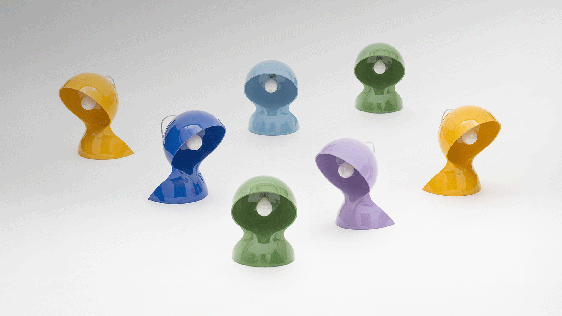 Five Artemide Dalù table lamps in a row, featuring a curved hood shade in purple, green, blue, yellow, and light blue