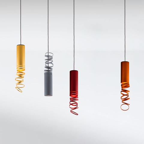 Four Artemide Decomposé Light pendant lamps in yellow, grey, red, and orange, each with a cylindrical body and a spiraling ribbon element.