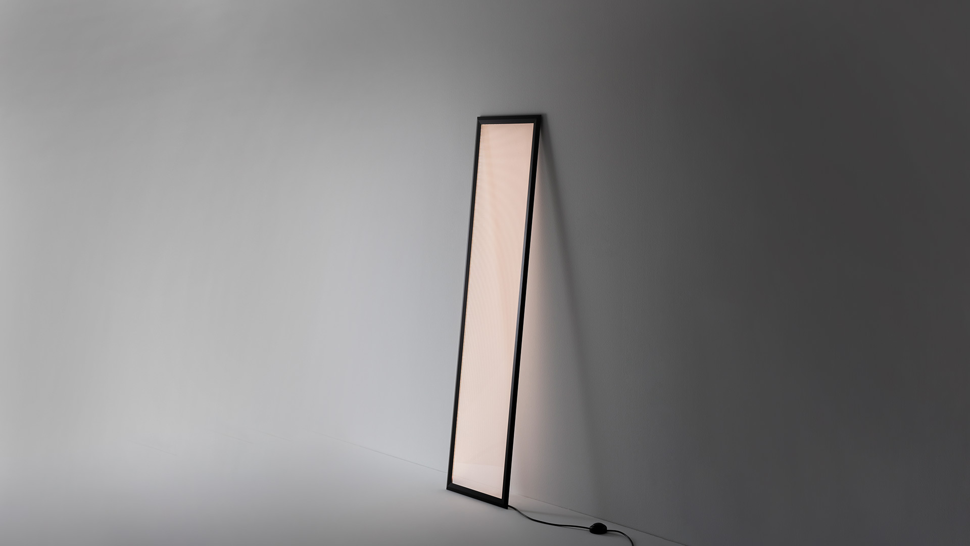 Artemide Discovery Terra floor lamp shown in three color modes: warm red, neutral white, and cool blue, leaning against a wall near stairs