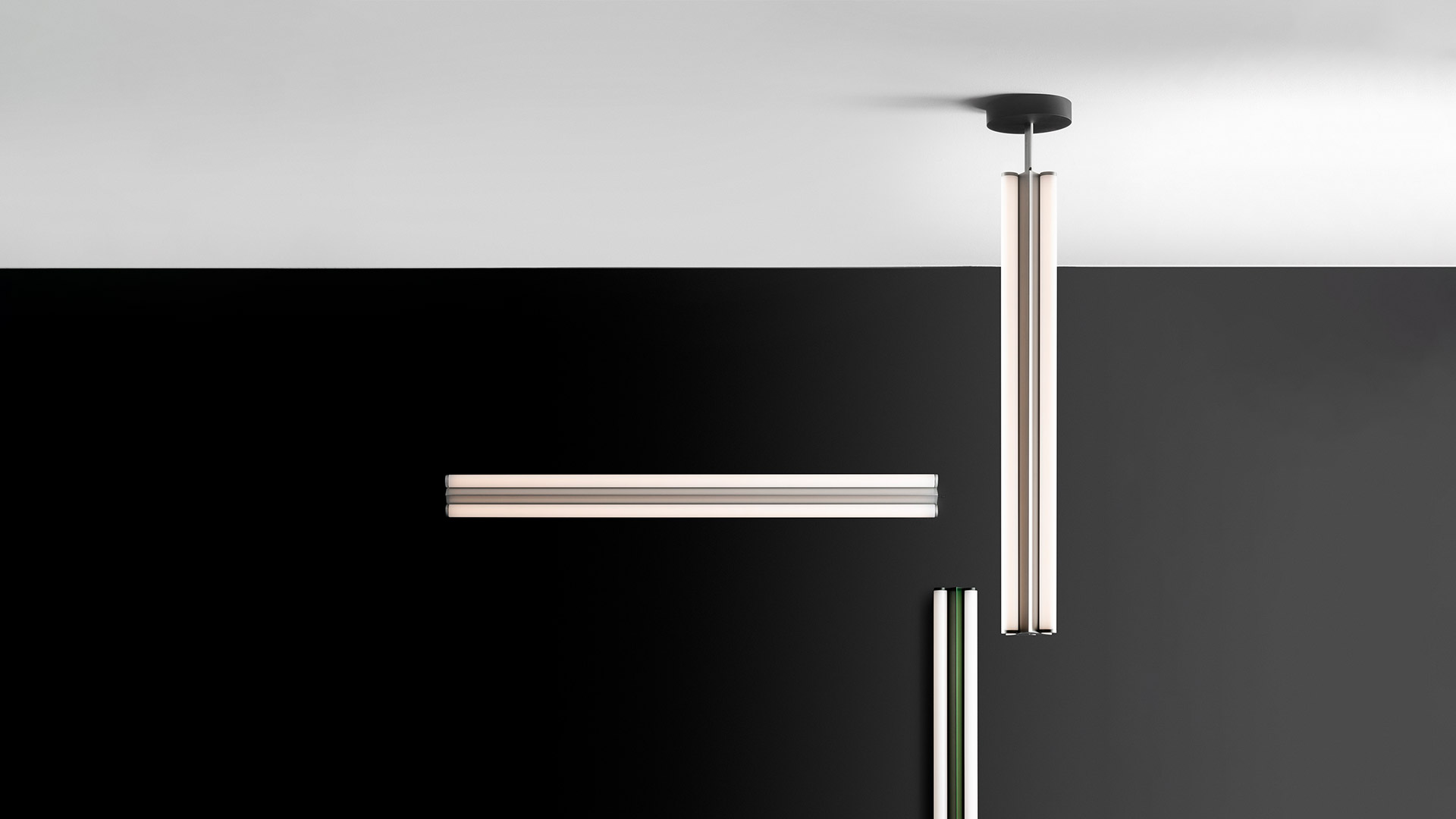 Artemide Dreispitz pendant lamp: elongated black linear fixture with white diffuser, suspended by black cable from ceiling canopy