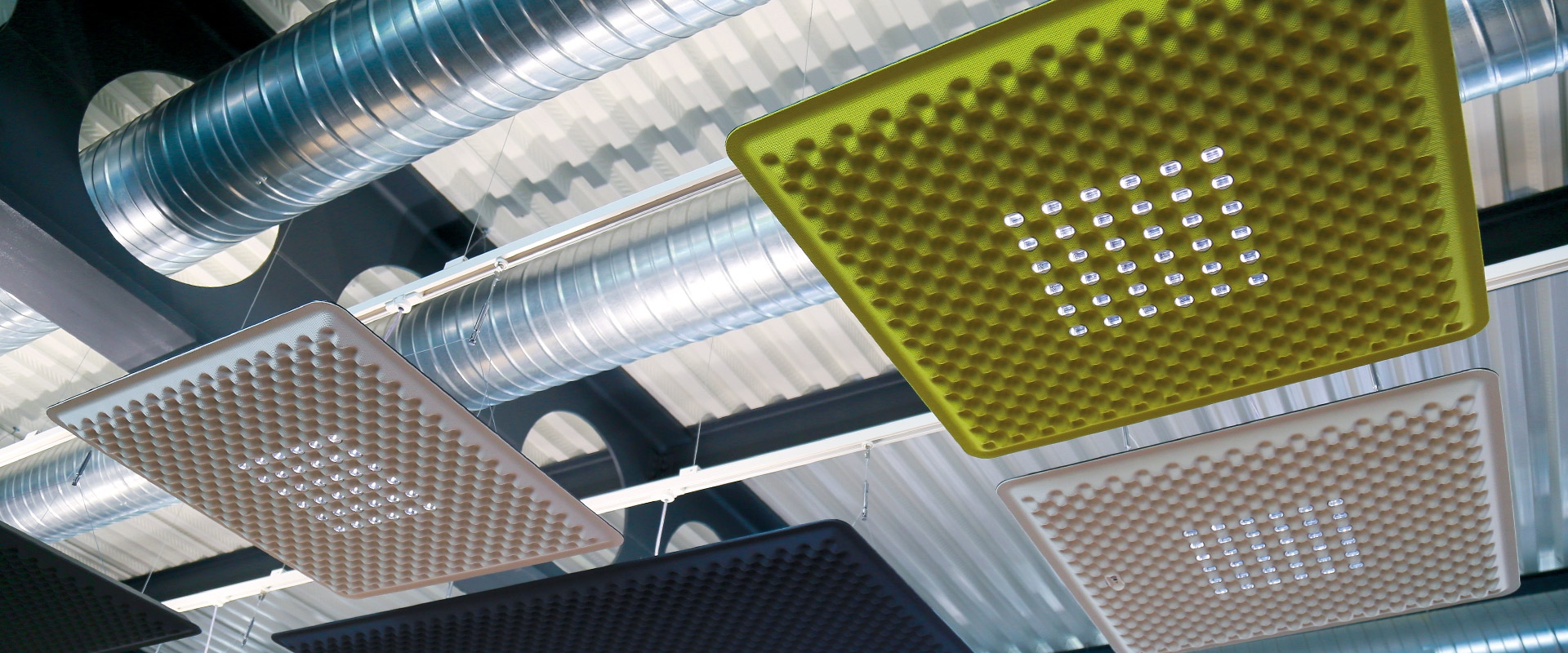 Artemide Eggboard Matrix pendant lamp: rectangular yellow acoustic panel with egg-crate texture and integrated LED lights, suspended by cables