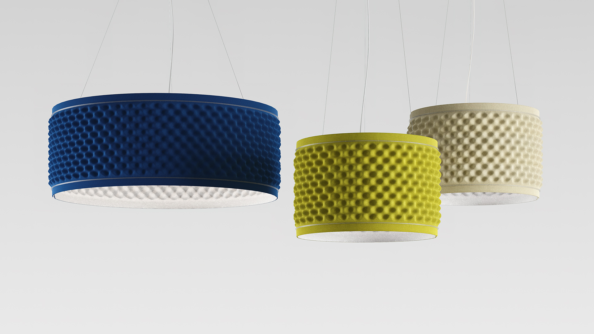Three Artemide Eggboard Circle pendant lamps in blue, yellow-green, and beige, featuring textured egg-crate diffusers on thin cables