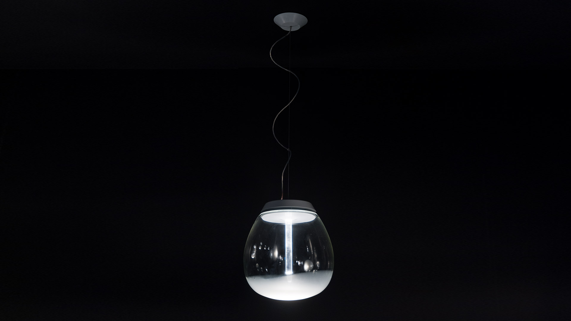 Artemide Empatia pendant lamp: teardrop-shaped clear glass diffuser with white LED strip, suspended by a black cable