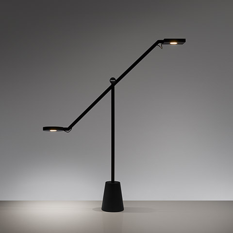 Artemide Equilibrist black table lamp with two LED heads on a balanced pivoting arm, mounted on a conical base