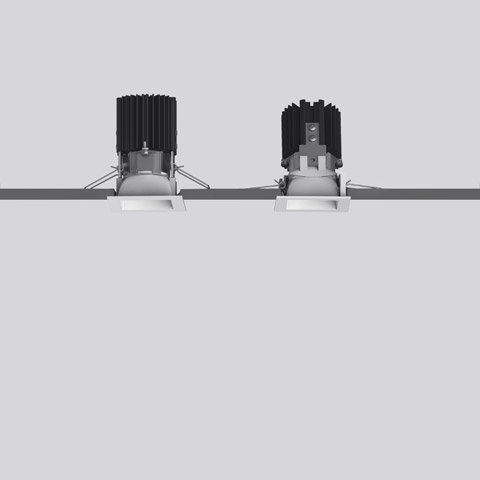Two Artemide Everything 55 square recessed spotlights with black heat sinks, white trim, adjustable heads, shown side by side