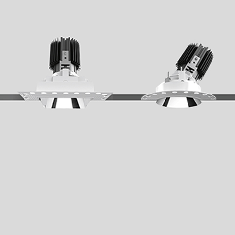 Artemide Everything 105 Trimless recessed spotlights: left fixed downlight, right adjustable tilted version, both with white trim and black heat sink