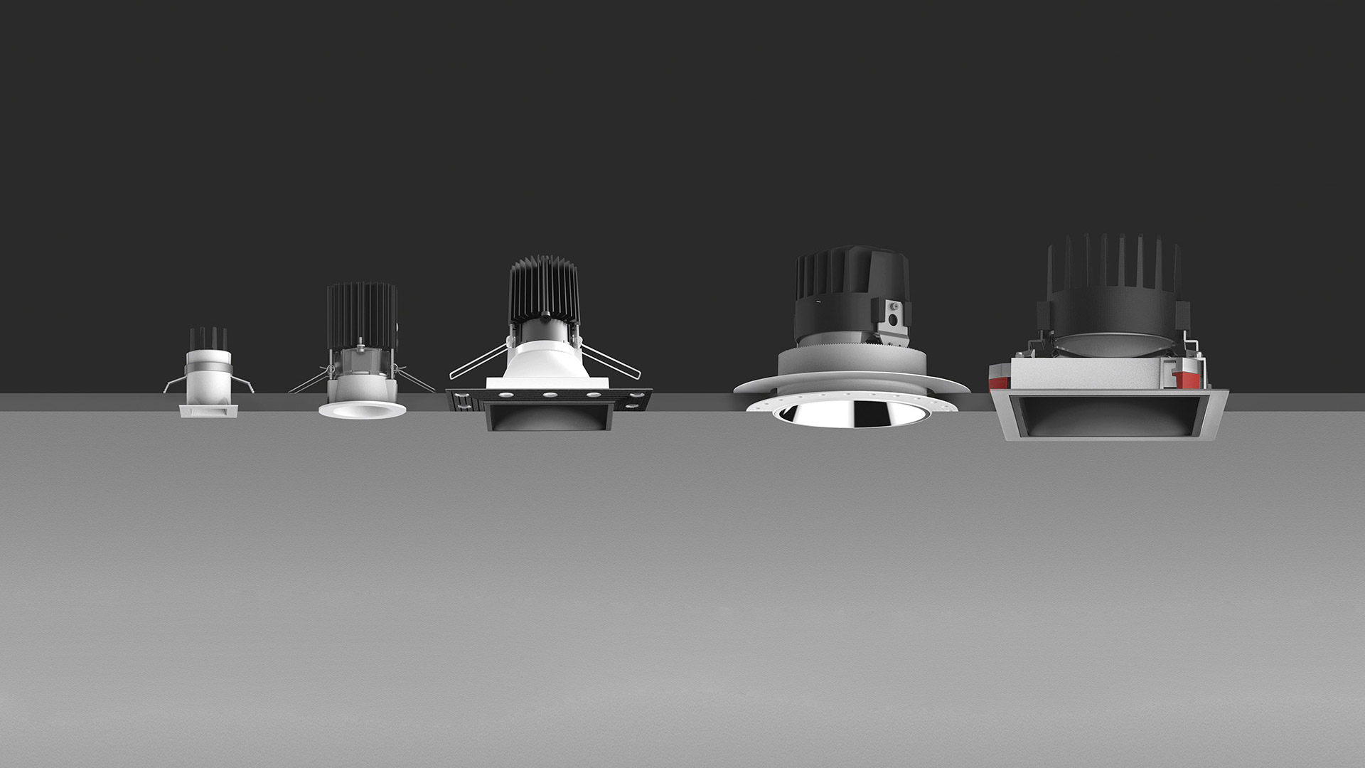 Five Artemide Everything 35 recessed downlights in a row, showing round and square variants in black and white finishes