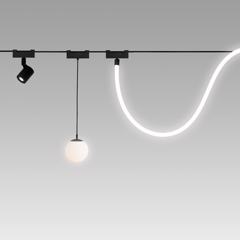 Artemide Funivia track system with adjustable spotlight, opal globe pendant, and flexible LED strip light on black rail