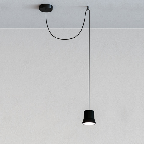 Artemide Giò Light Decentrata: black pendant lamp with truncated cone shade, off-center ceiling canopy, and looping black cord