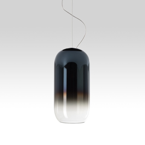 Artemide Gople pendant lamp: elongated capsule-shaped blown glass, gradient from dark grey top to transparent base, suspended by thin cables