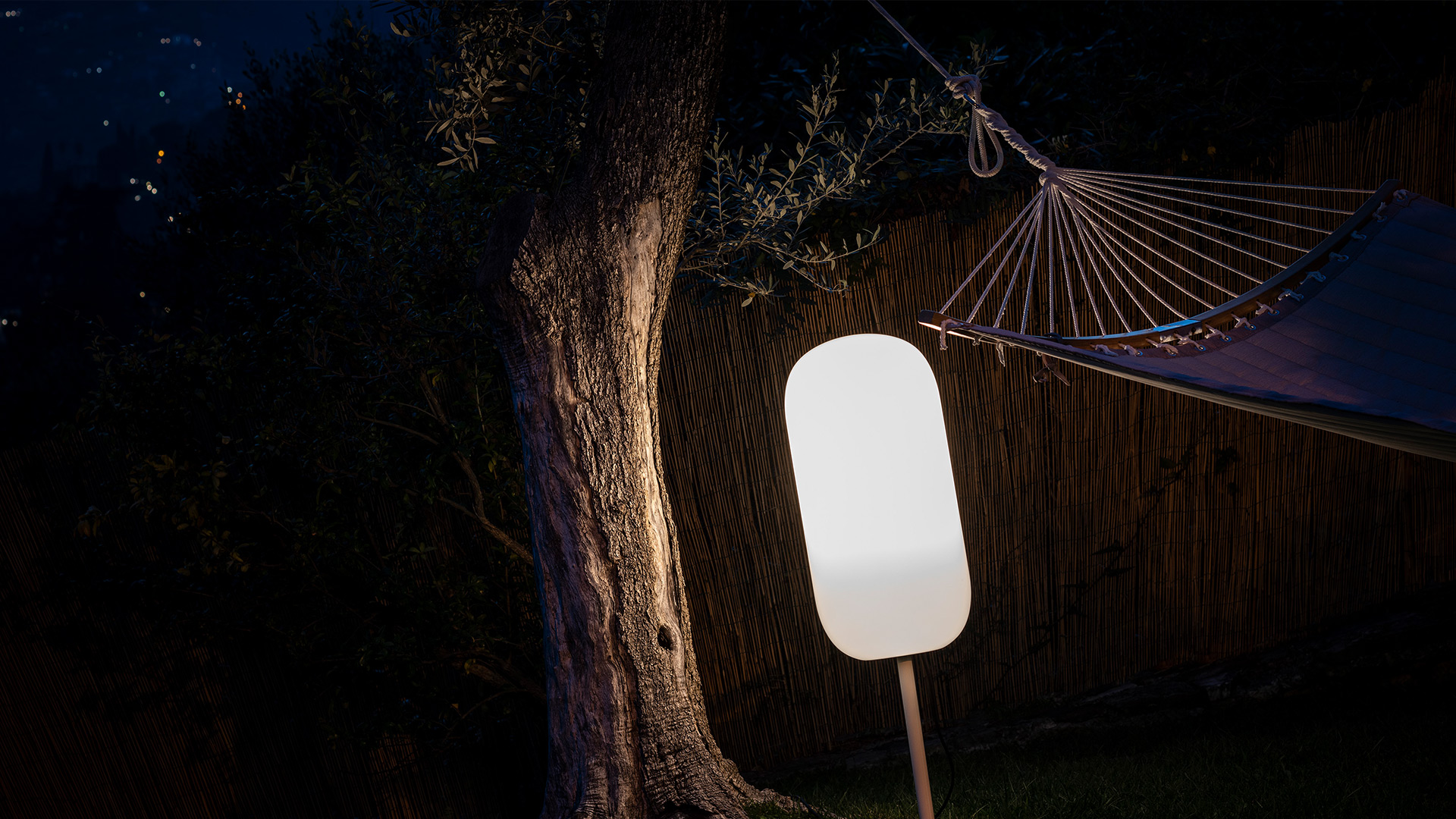 Artemide Gople Outdoor lamps: one pendant and one floor lamp with two table lamps, featuring white opal glass capsule shades on a light blue background