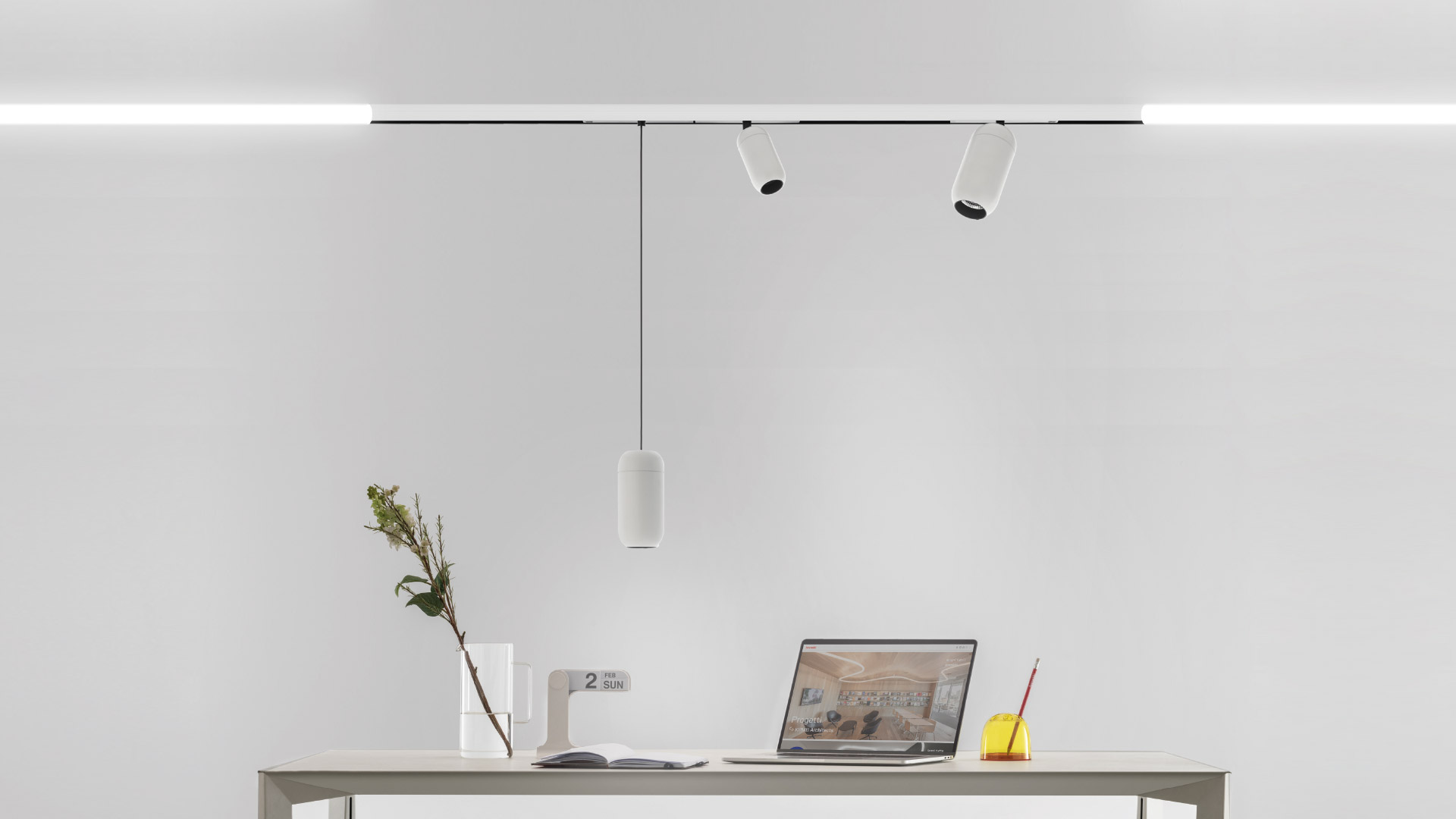 Artemide Gople System pendants in black and white hang near a glowing circular LED ring and a large curved LED light installation in a modern interior