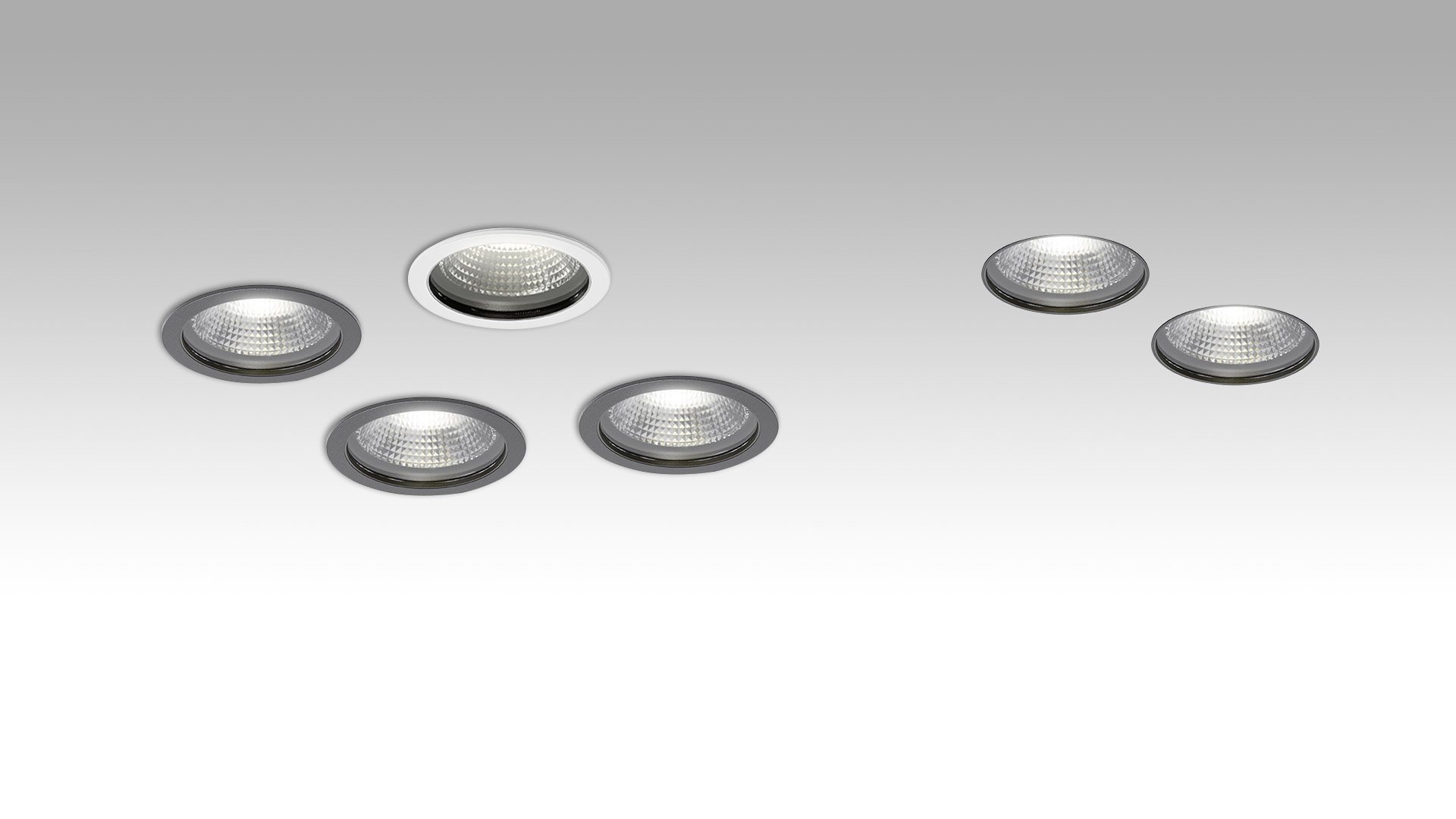 Artemide Hoy collection: four spotlights in white and black finishes, including recessed, surface-mounted, and track-mounted versions
