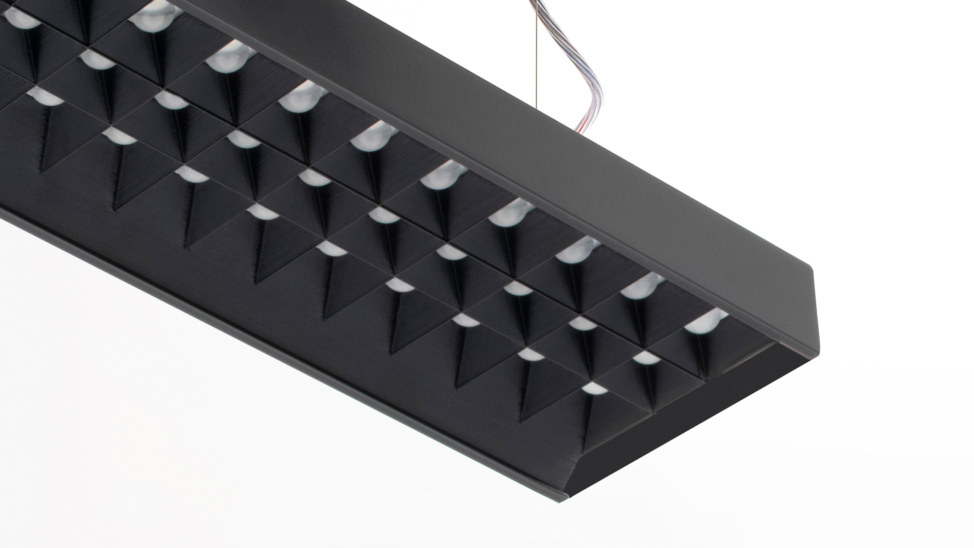 Artemide Hoy System: black suspended linear LED bar with diffused light strip and two adjustable black spotlights underneath