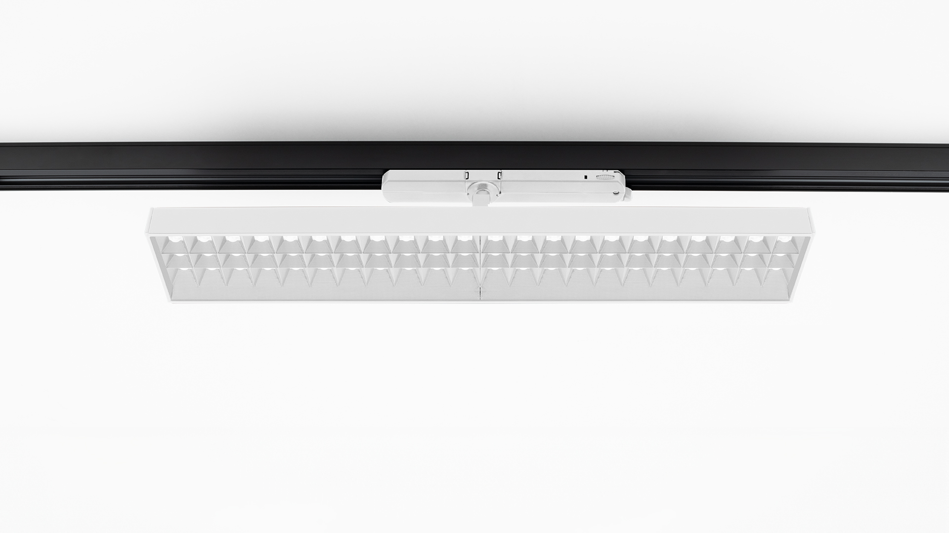 Artemide Hoy Refractive 3-Phase Track: white rectangular LED fixture with refractive lens grid, mounted on black three-phase track
