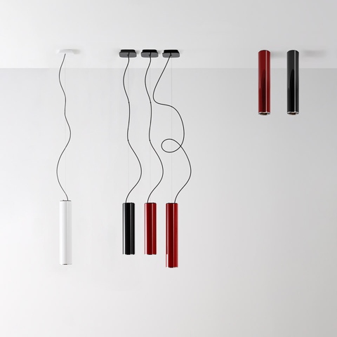 Artemide Ilio pendant and surface-mounted spotlights in white, black, and red cylindrical tubes with wavy cables