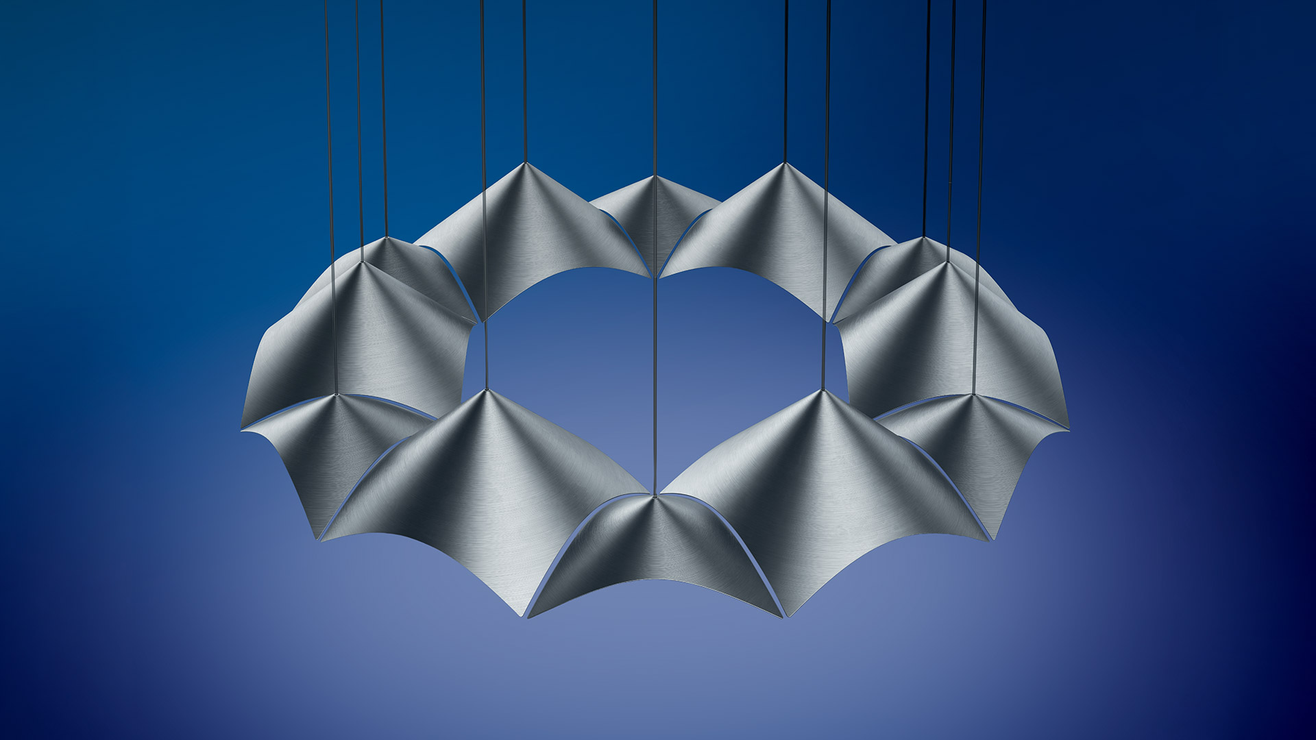 Artemide Iperbole pendant lamp: circular arrangement of overlapping translucent white petal-shaped shades suspended by thin cables