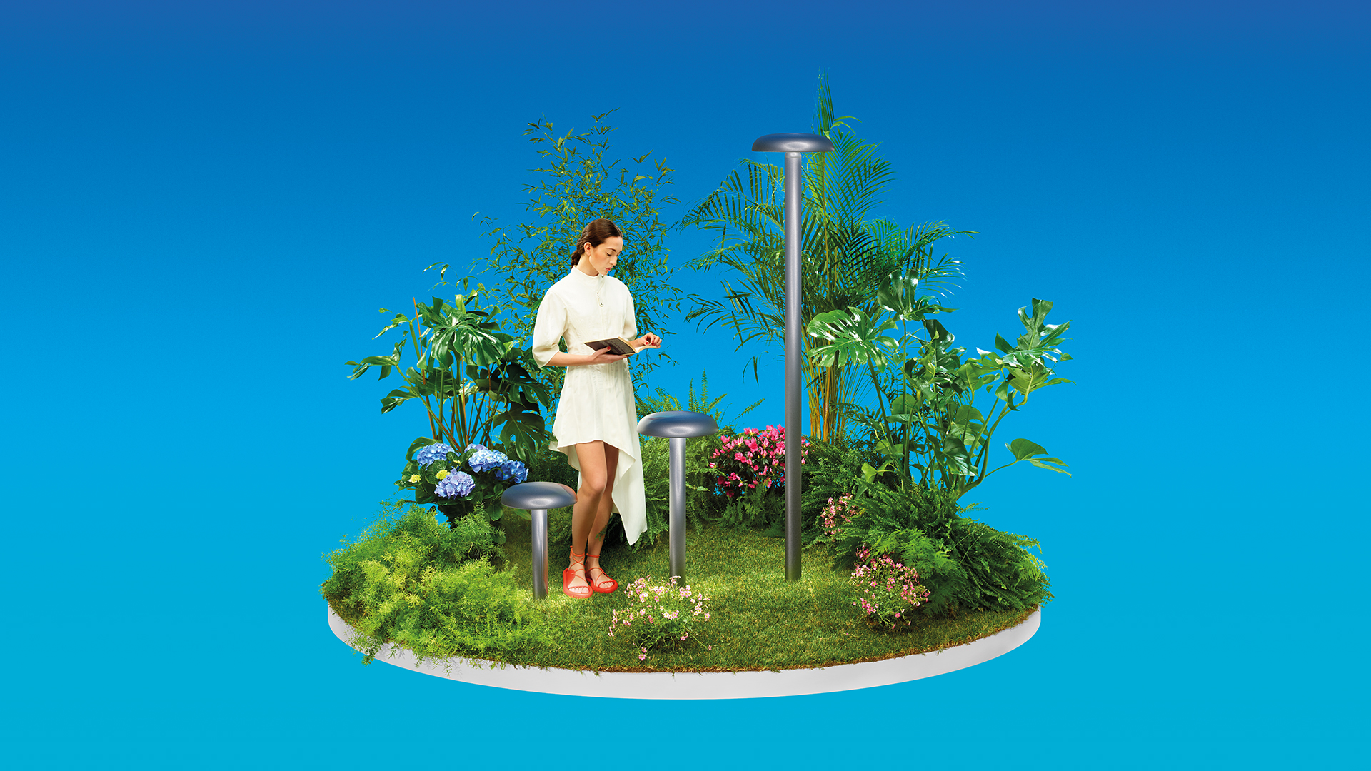 Artemide Knop outdoor bollard lights illuminate a garden at dusk, with mushroom-shaped fixtures on slim poles casting warm light on grass