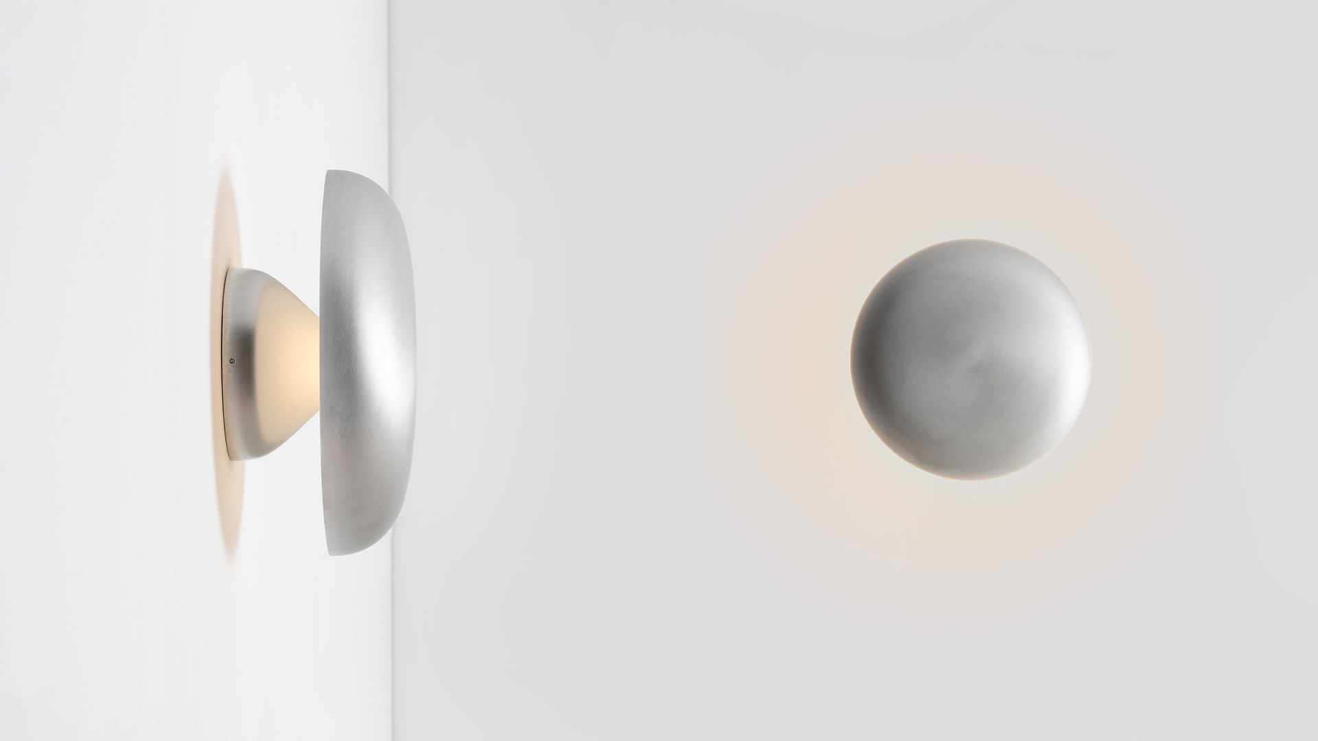 Artemide Knop collection: three floor lamps in graduated heights and a wall light, all in brushed aluminum with disc-shaped LED heads