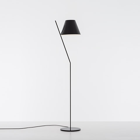 Artemide La Petite Floor lamp in black, featuring a slanted stem, conical shade, and circular base on white background