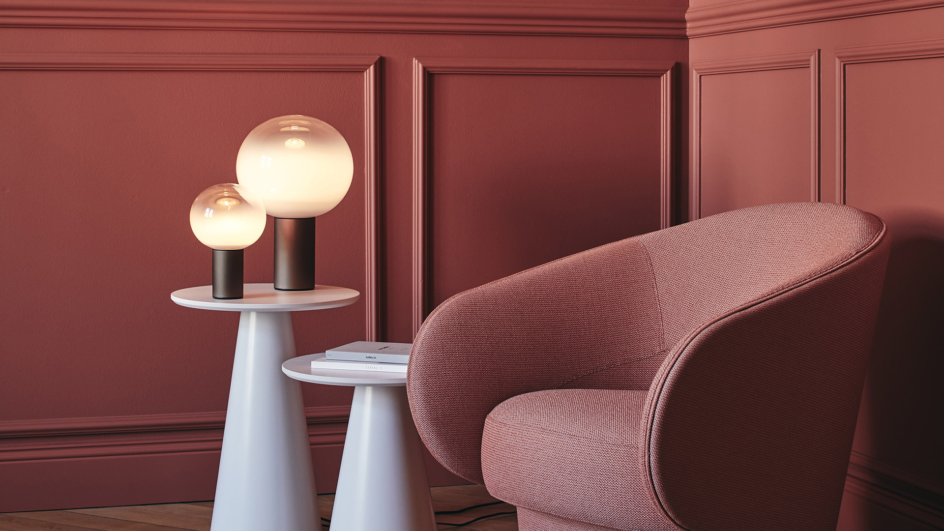 Three Artemide Laguna Tavolo table lamps in small, medium, and large sizes, with opal glass globe shades on brushed brass cylindrical bases