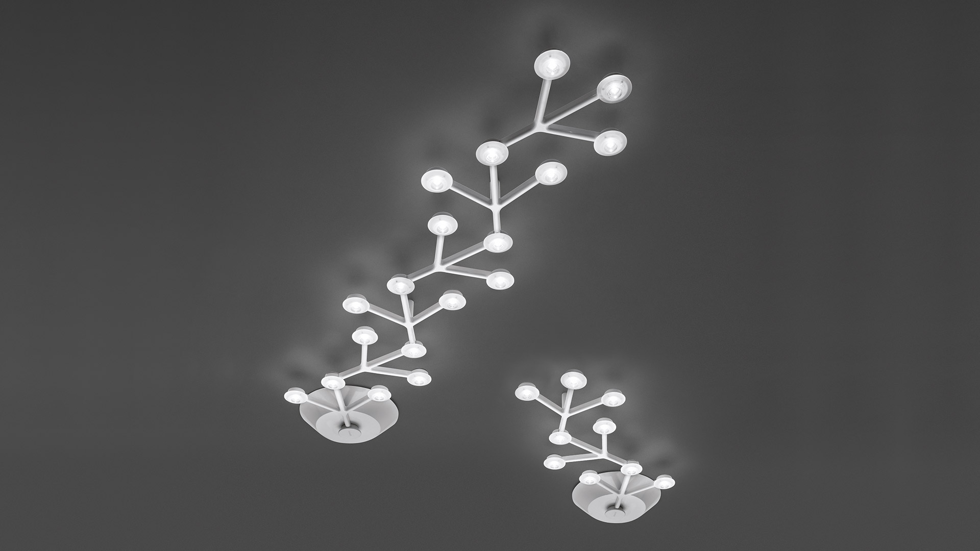 Artemide LED Net and LED Net Lineare ceiling lights with branching white arms and glowing spherical LED nodes on grey ceiling