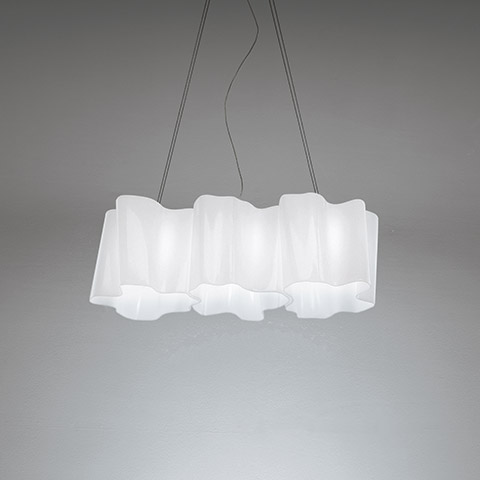 Artemide Logico suspension 3 in linea: three white opal diffusers in a row, soft organic shapes, hanging from gray cables