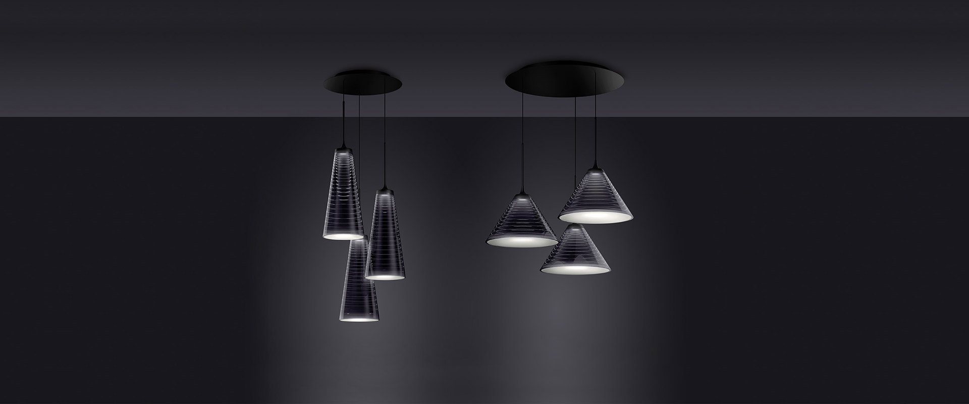 Artemide Look at Me pendant lamp with dark conical metal shade and opal diffuser, suspended from a black cord