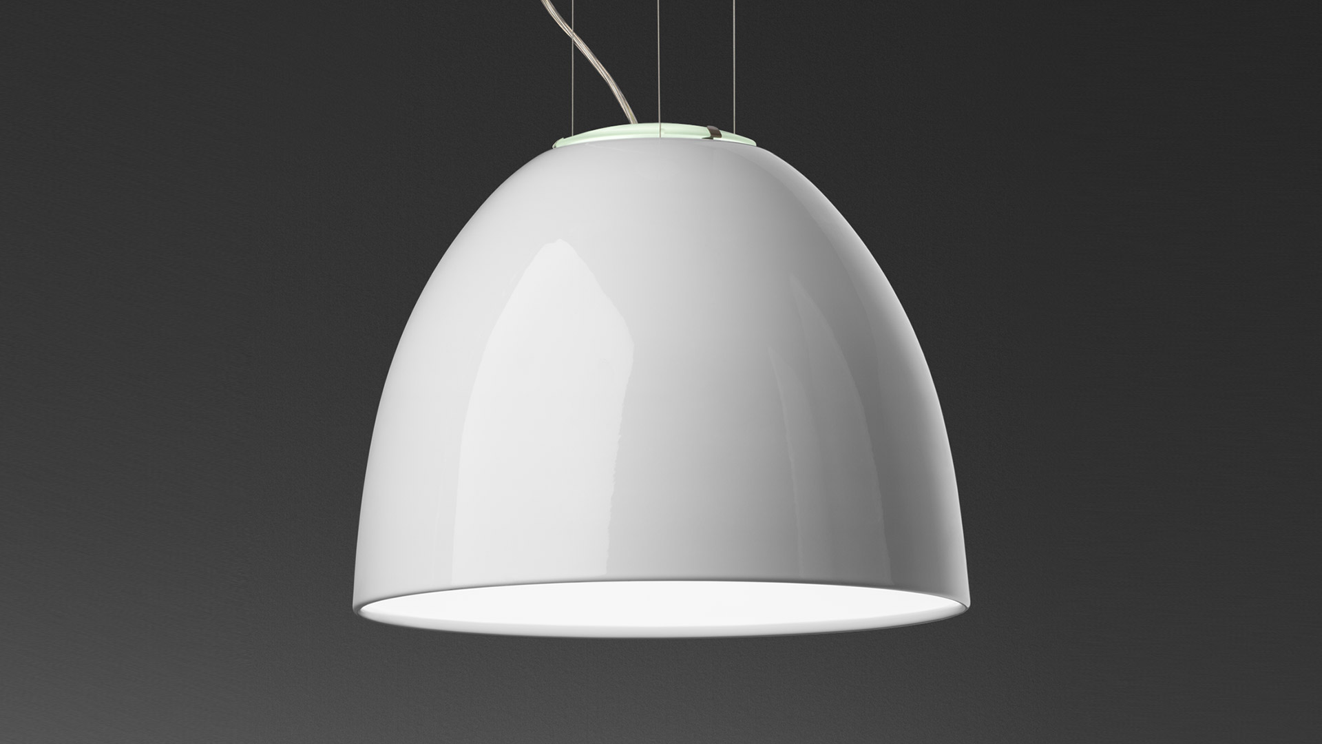Artemide Nur Gloss pendant lamp with glossy black dome-shaped shade, white interior, suspended by thin cables